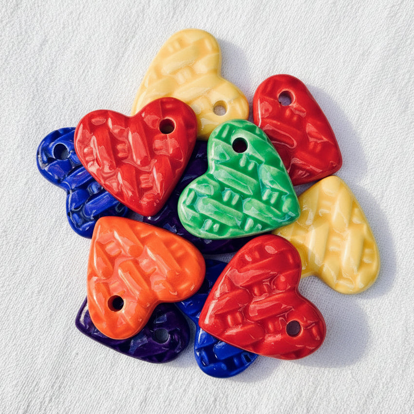 Colorful heart-shaped ceramics with a hole
