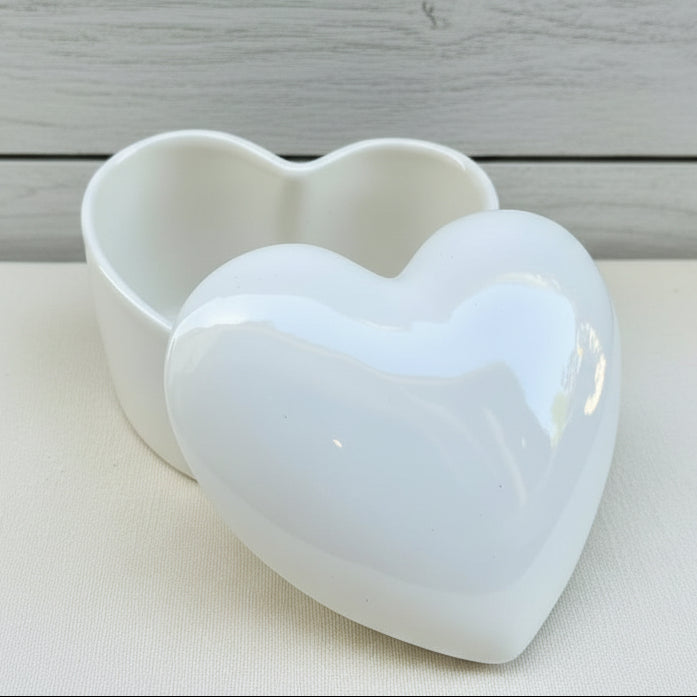 A heart shaped ceramic urn
