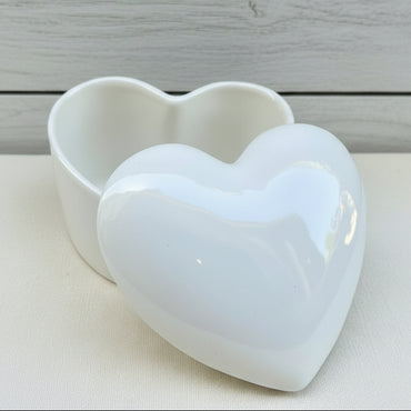 A heart shaped ceramic urn