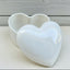 A heart shaped ceramic urn