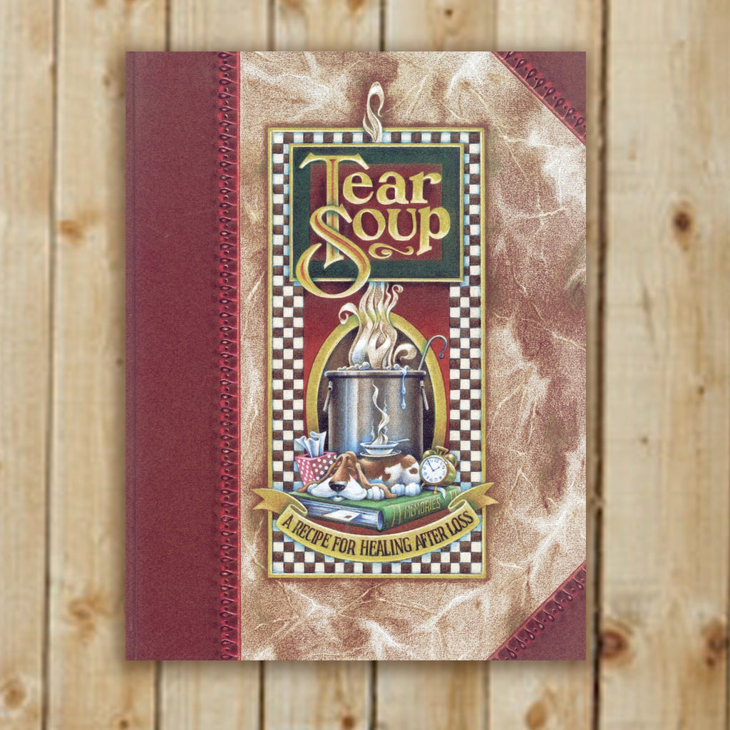 Book titled 'Tear Soup' on a wooden background