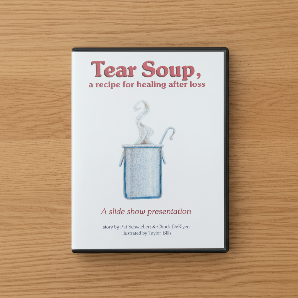 PowerPoint cover titled 'Tear Soup, a recipe for healing after loss' on a wooden surface