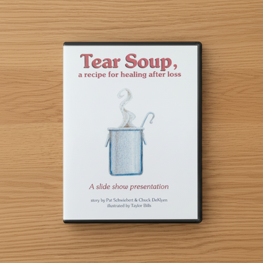 PowerPoint cover titled 'Tear Soup, a recipe for healing after loss' on a wooden surface